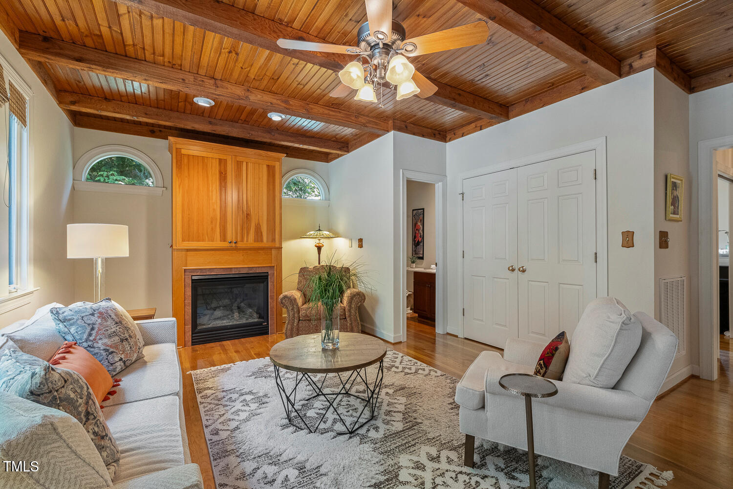101 Cardiff Place Chapel Hill, NC 27516 - Photo 29 of 82 a living room with furniture a rug and a fireplace