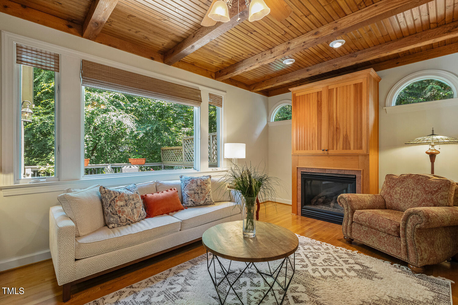 101 Cardiff Place Chapel Hill, NC 27516 - Photo 31 of 82 a living room with furniture a fireplace and a table