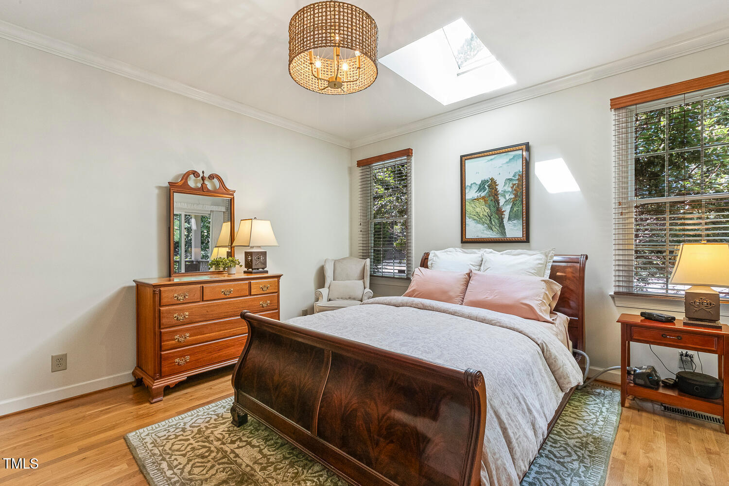101 Cardiff Place Chapel Hill, NC 27516 - Photo 41 of 82 a bedroom with a bed and a dresser next to a window