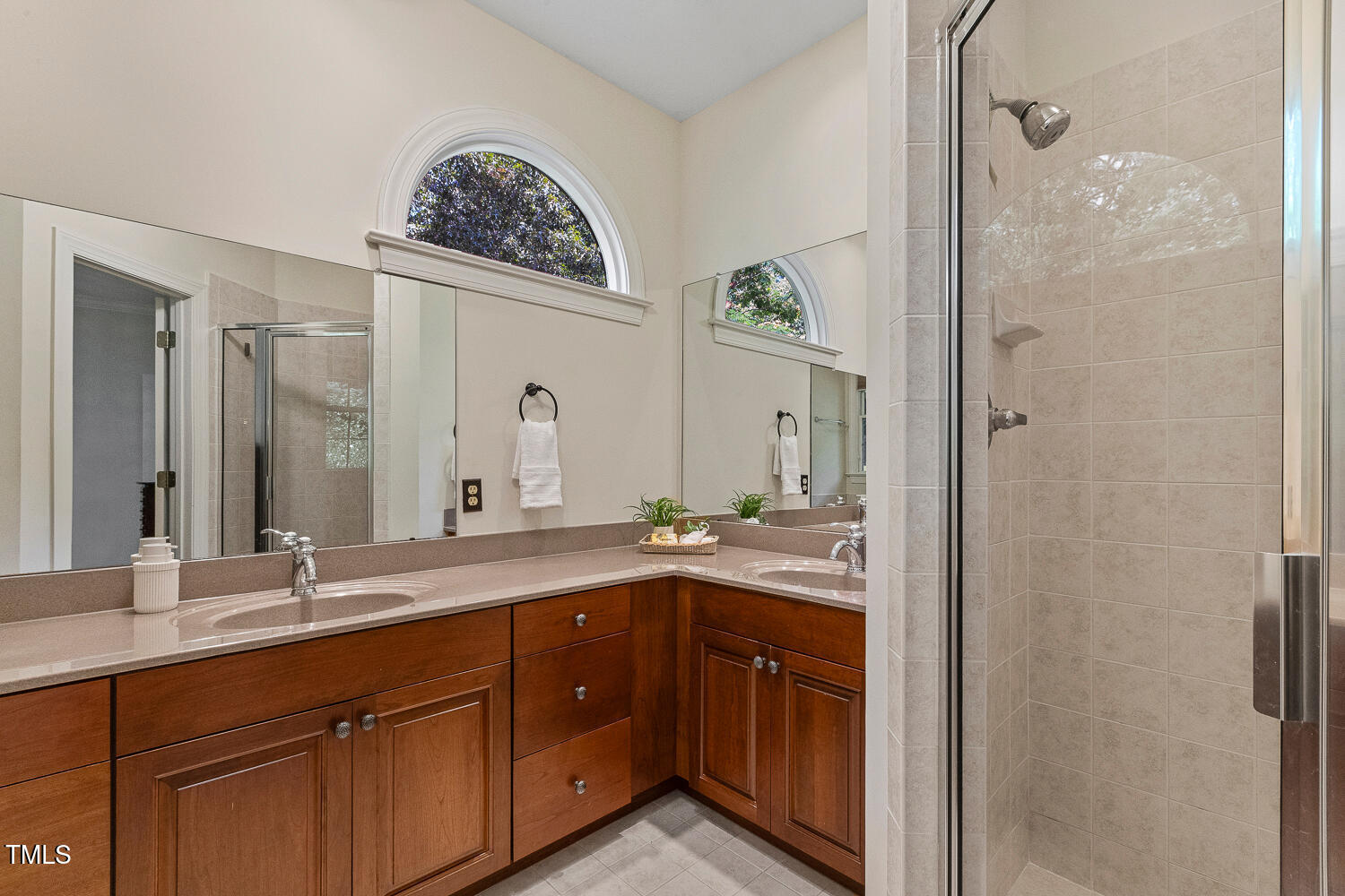 101 Cardiff Place Chapel Hill, NC 27516 - Photo 43 of 82 a spacious bathroom with a double vanity sink and a mirror