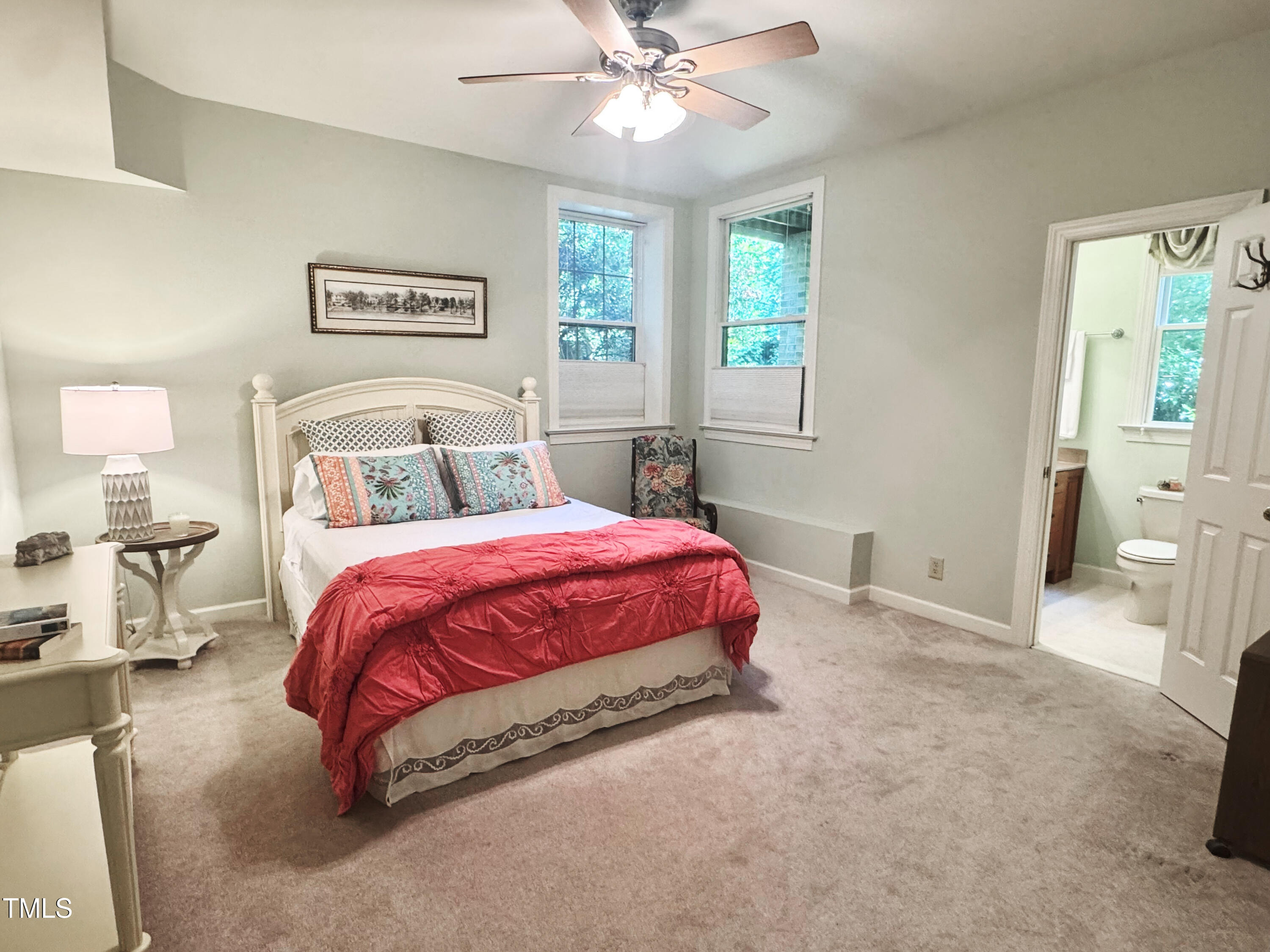 101 Cardiff Place Chapel Hill, NC 27516 - Photo 60 of 82 a spacious bedroom with a bed and a chandelier