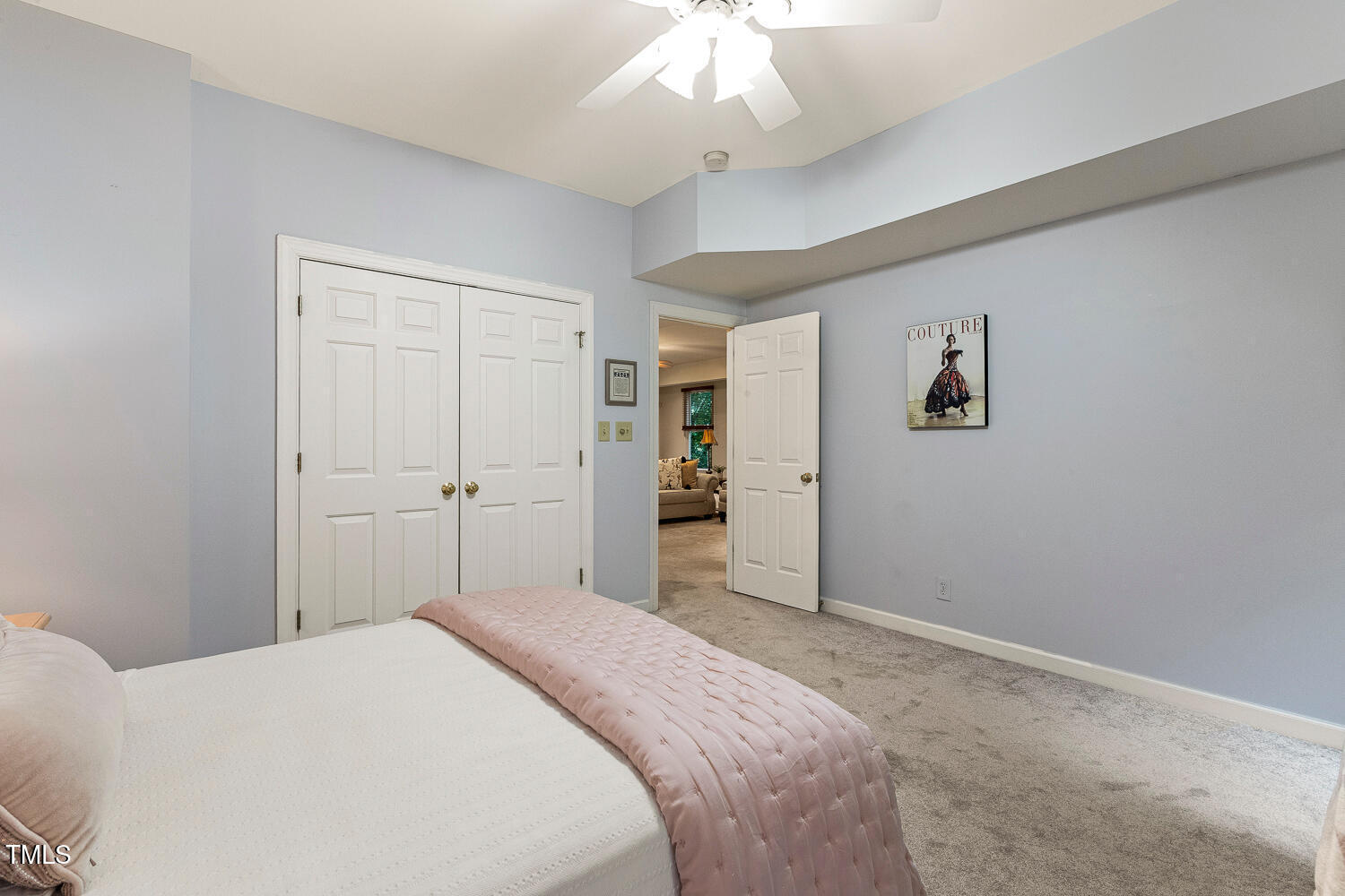 101 Cardiff Place Chapel Hill, NC 27516 - Photo 68 of 82 a bedroom with a bed and a chandelier