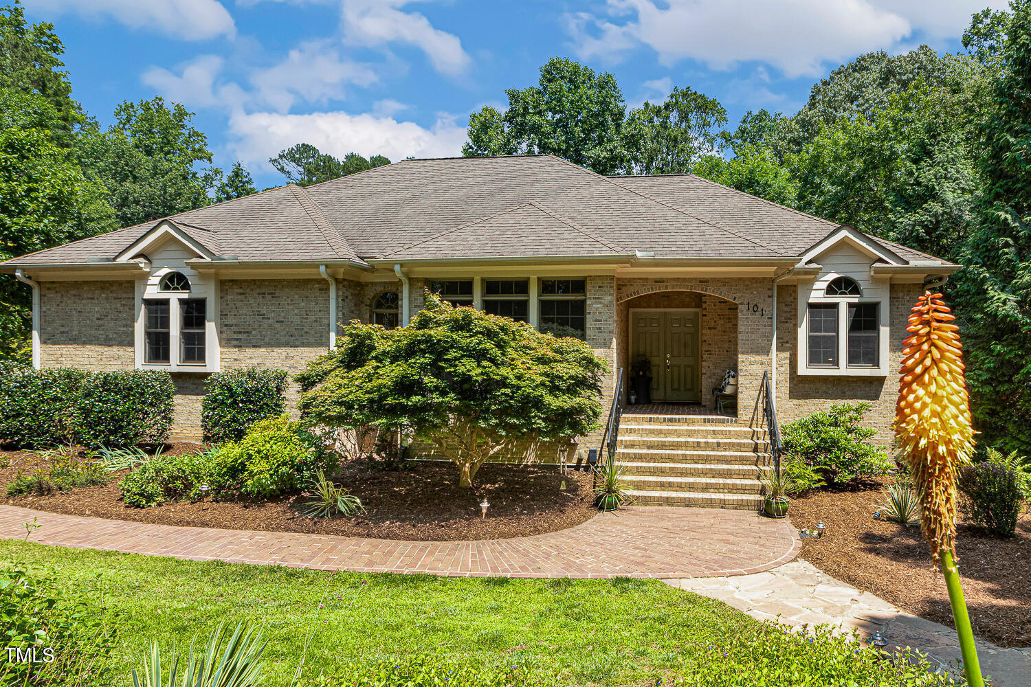 101 Cardiff Place Chapel Hill, NC 27516 - Photo 8 of 82 a front view of a house with a yard and garage