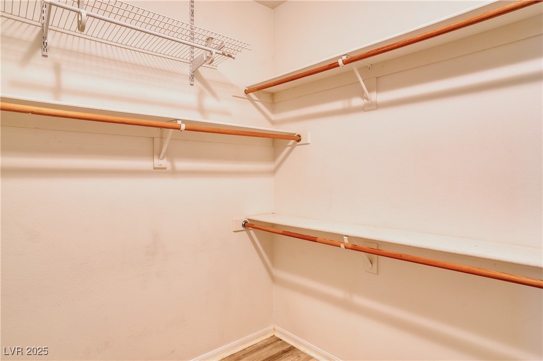 2383 Rainswept Avenue Henderson, NV 89052 - Photo 28 of 62 Spacious closet with light wood-style floors