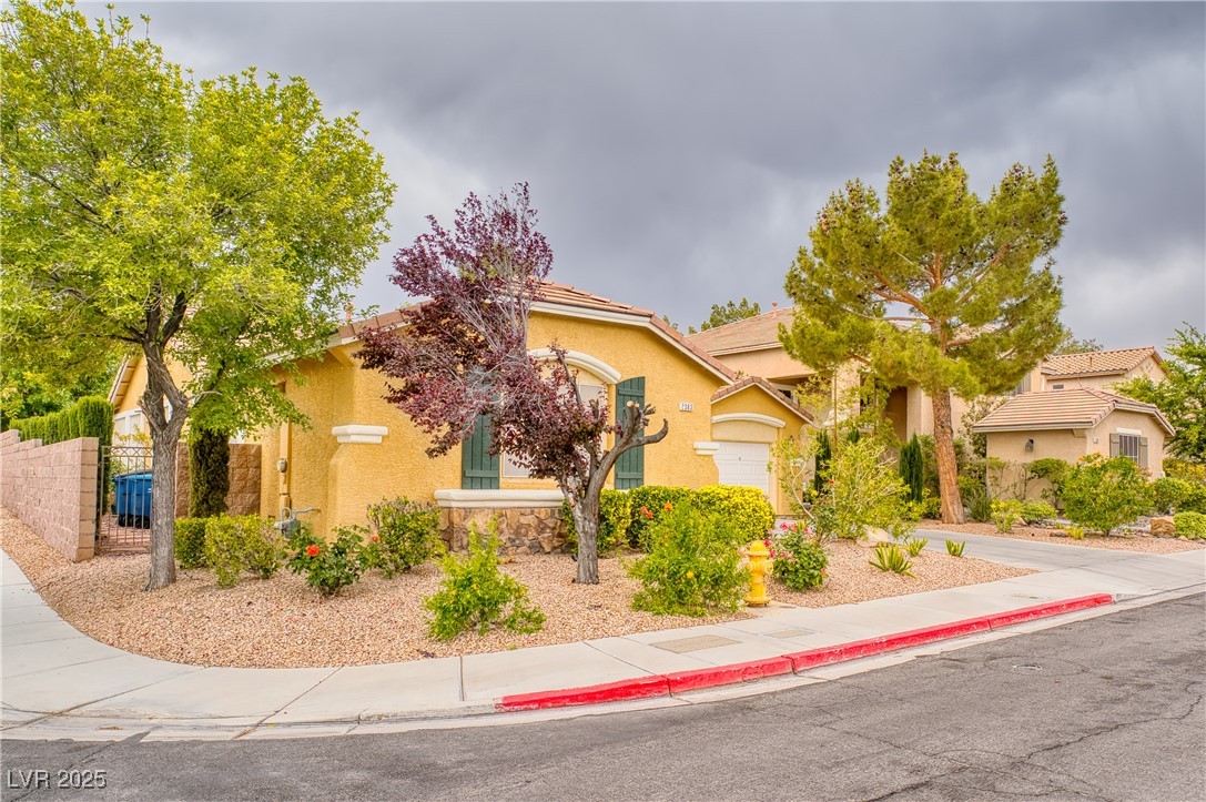2383 Rainswept Avenue Henderson, NV 89052 - Photo 3 of 62 View of front of property featuring stucco siding and a tile roof