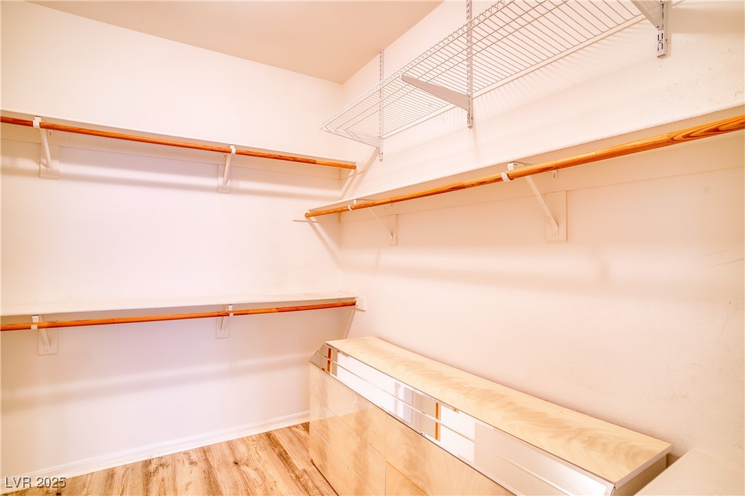 2383 Rainswept Avenue Henderson, NV 89052 - Photo 29 of 62 Walk in closet featuring wood finished floors