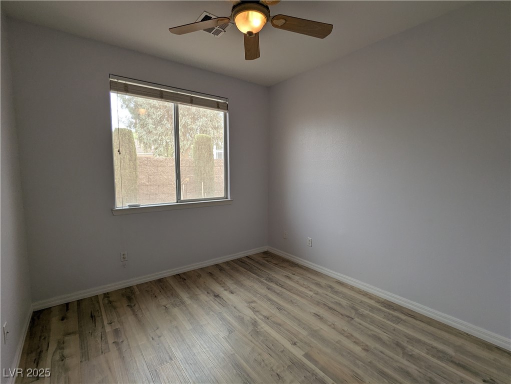 2383 Rainswept Avenue Henderson, NV 89052 - Photo 33 of 62 Empty room with light wood-type flooring and ceiling fan, recently updated