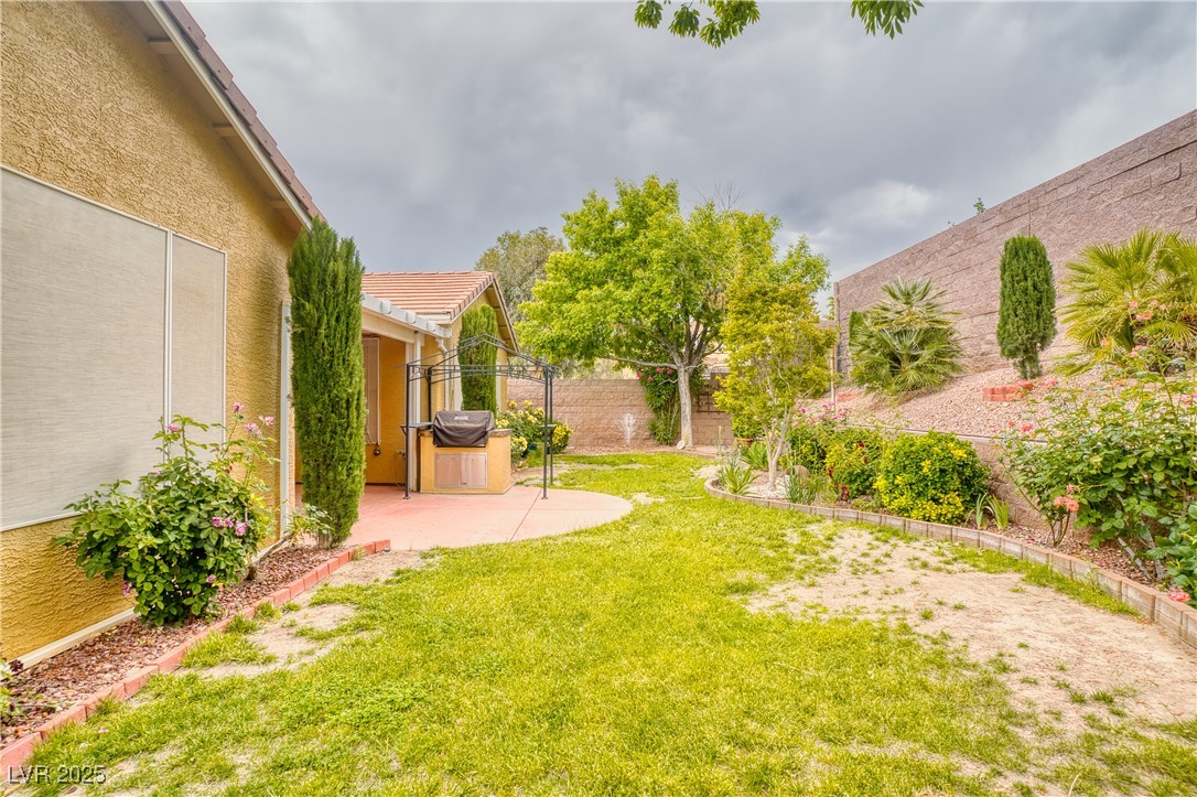 2383 Rainswept Avenue Henderson, NV 89052 - Photo 39 of 62 Fenced backyard featuring a patio area