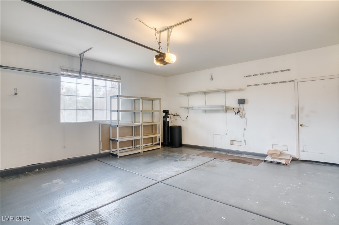 2383 Rainswept Avenue Henderson, NV 89052 - Photo 43 of 62 Garage featuring baseboards and a garage door opener