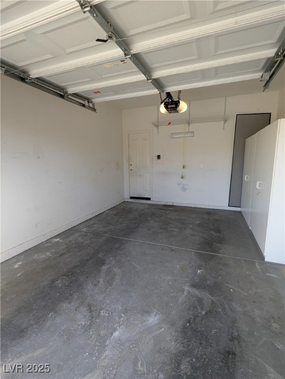 2383 Rainswept Avenue Henderson, NV 89052 - Photo 45 of 62 Garage with a garage door opener and baseboards