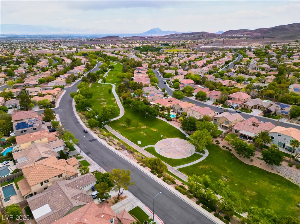 2383 Rainswept Avenue Henderson, NV 89052 - Photo 58 of 62 Aerial perspective of suburban area featuring a mountain backdrop
