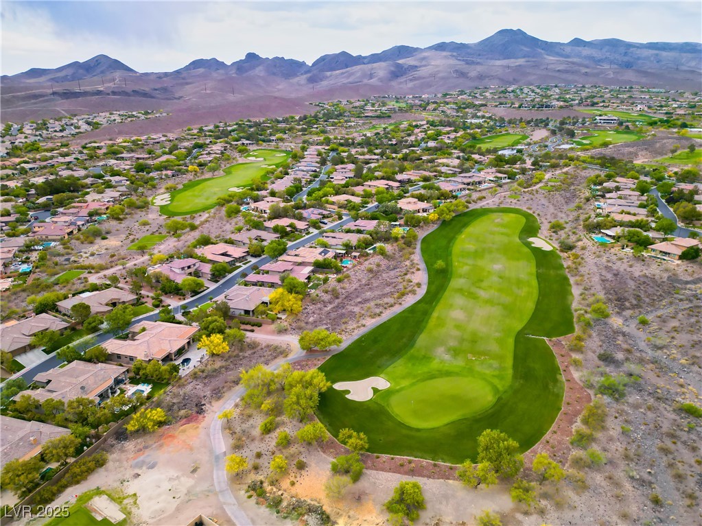 2383 Rainswept Avenue Henderson, NV 89052 - Photo 59 of 62 Aerial view of property's location with a local golf course and nearby suburban area