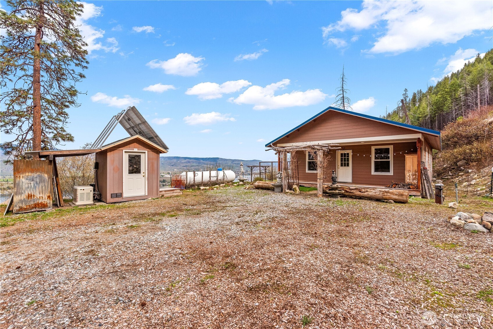 109 Granite Falls Road Chelan, WA 98816 - Photo 1 of 22 a front view of a house with a yard