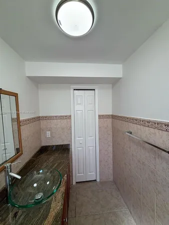 a room with window and a rug