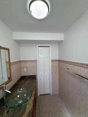 a room with window and a rug