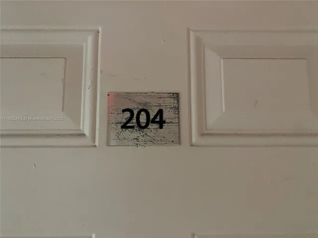 a kitchen with a stove a sink and a refrigerator