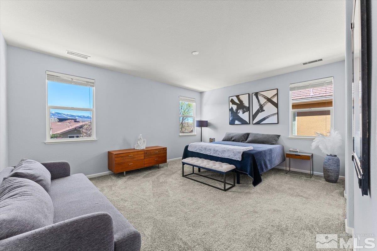 11215 Torino Way Reno, NV 89521 - Photo 12 of 21 a bedroom with furniture and a couch