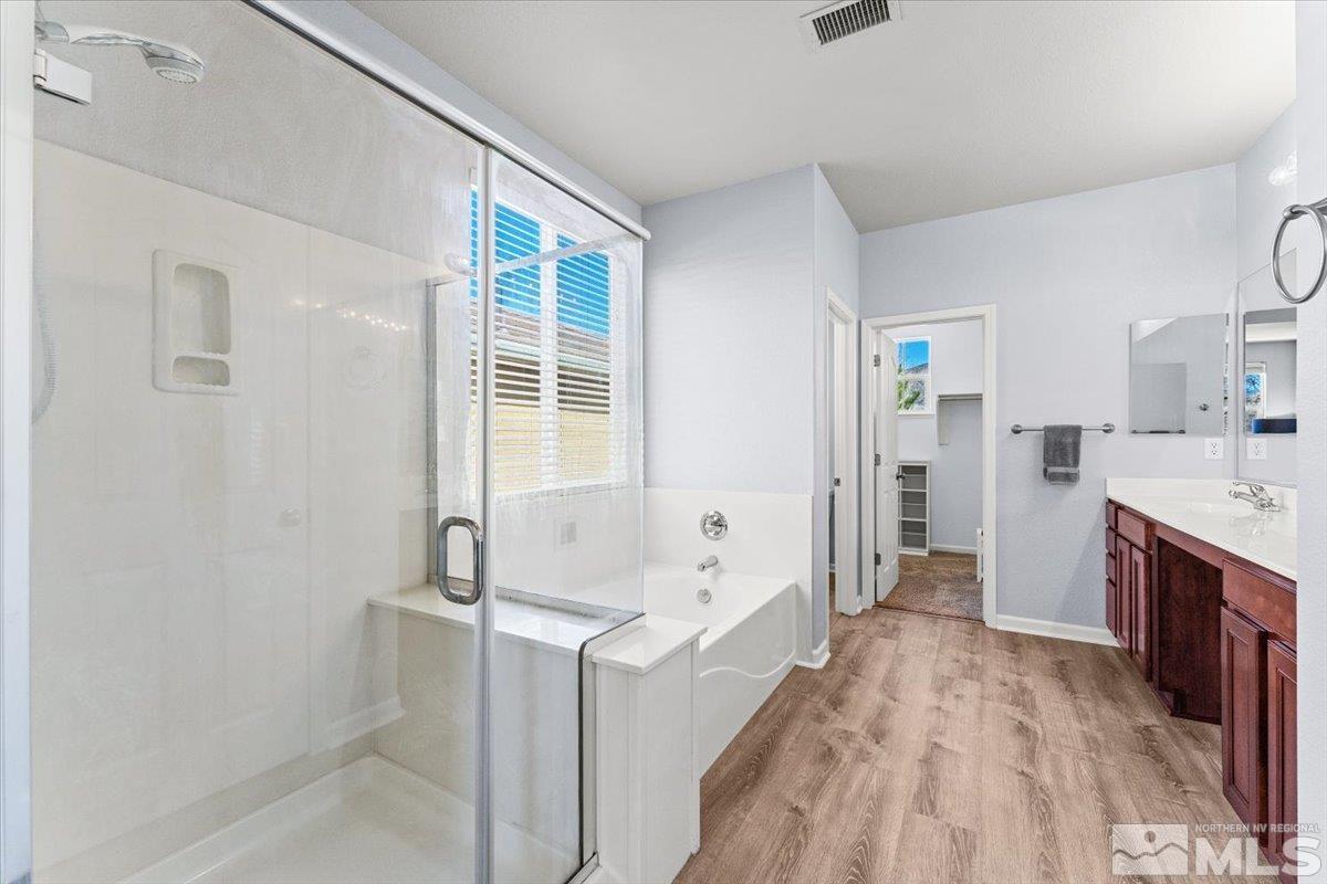 11215 Torino Way Reno, NV 89521 - Photo 13 of 21 a bathroom with a tub sink and mirror