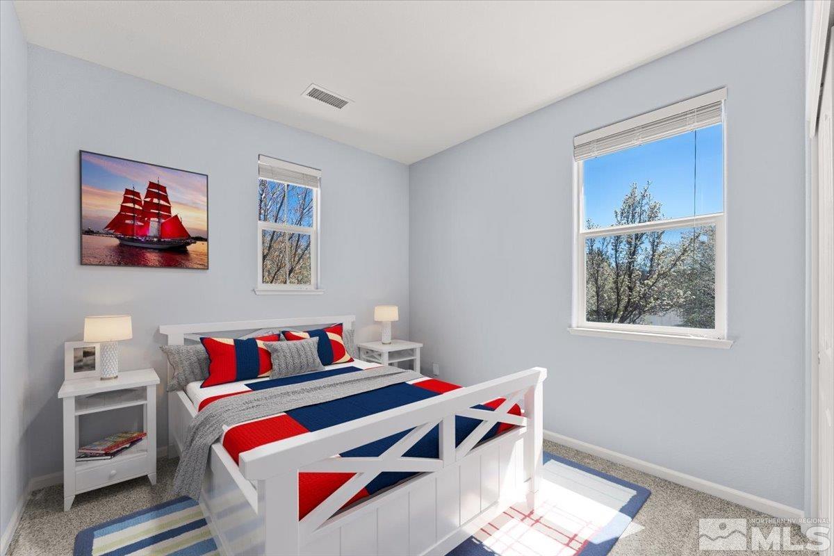 11215 Torino Way Reno, NV 89521 - Photo 15 of 21 a bedroom with furniture and a painting on the wall