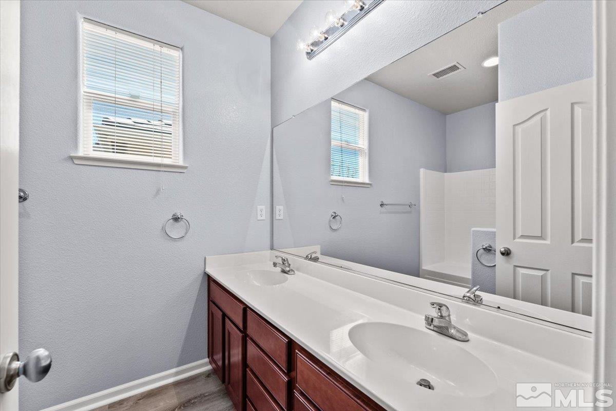 11215 Torino Way Reno, NV 89521 - Photo 17 of 21 a bathroom with a sink and a mirror