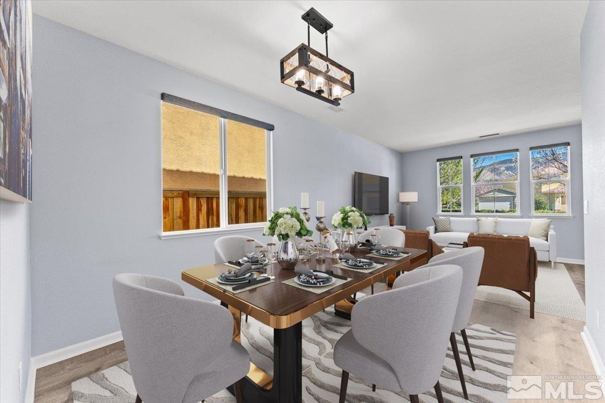 11215 Torino Way Reno, NV 89521 - Photo 3 of 21 a view of a dining room with furniture window and outside view