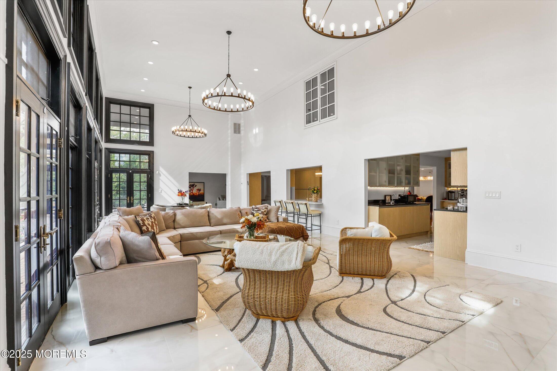13 Valley Forge Road Eatontown, NJ 07724 - Photo 26 of 74 a living room with furniture a dining table and a fireplace