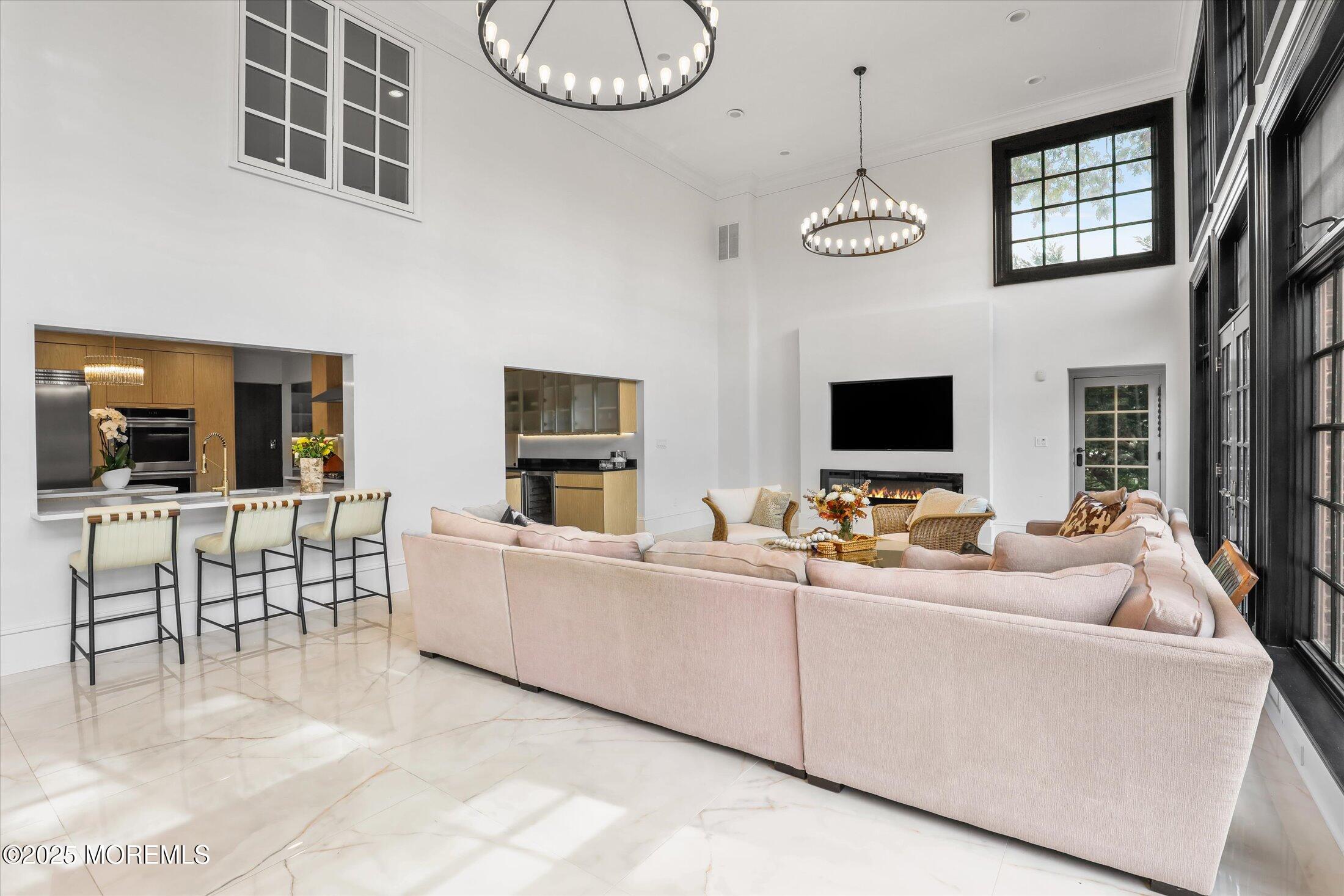 13 Valley Forge Road Eatontown, NJ 07724 - Photo 27 of 74 a living room with furniture and a flat screen tv