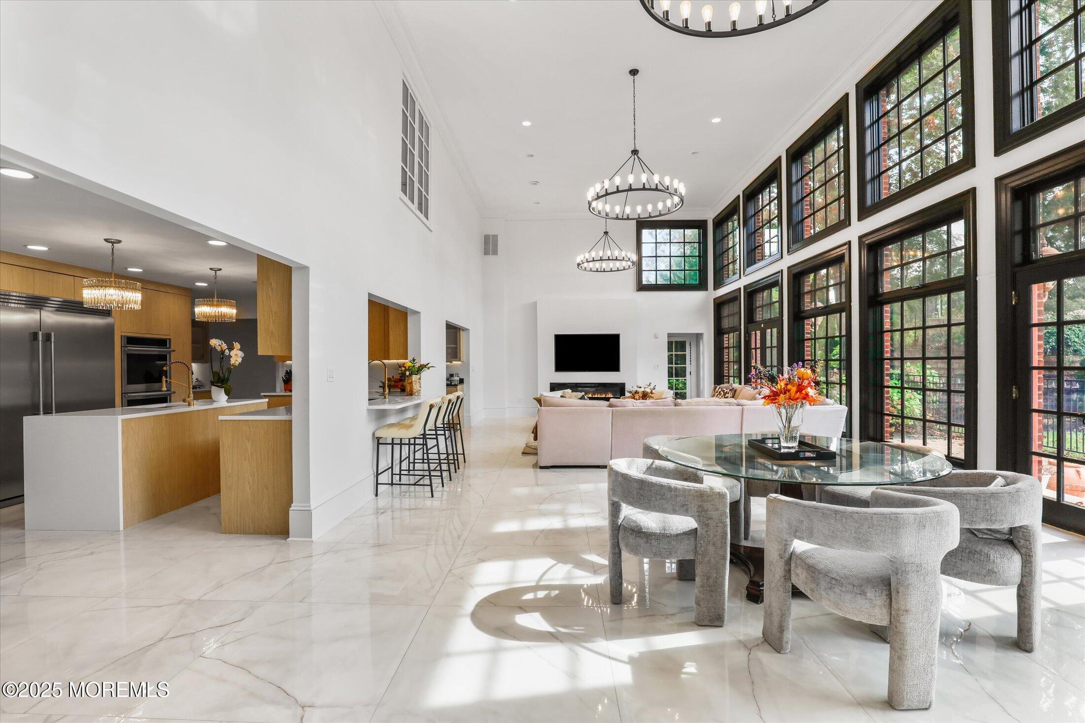 13 Valley Forge Road Eatontown, NJ 07724 - Photo 29 of 74 a living room with furniture a flat screen tv and a large window