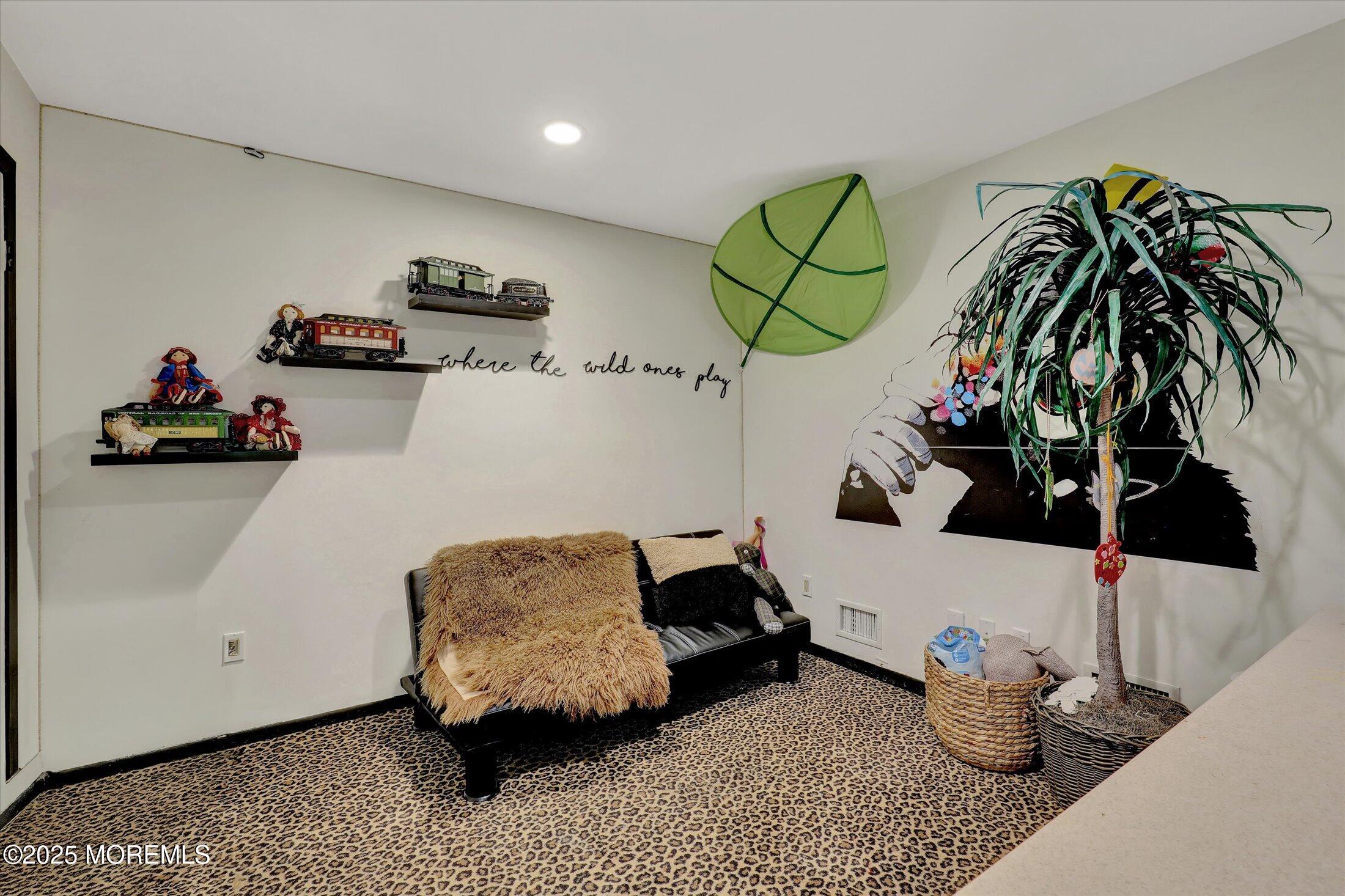 13 Valley Forge Road Eatontown, NJ 07724 - Photo 36 of 74 a living room with furniture and a potted plant