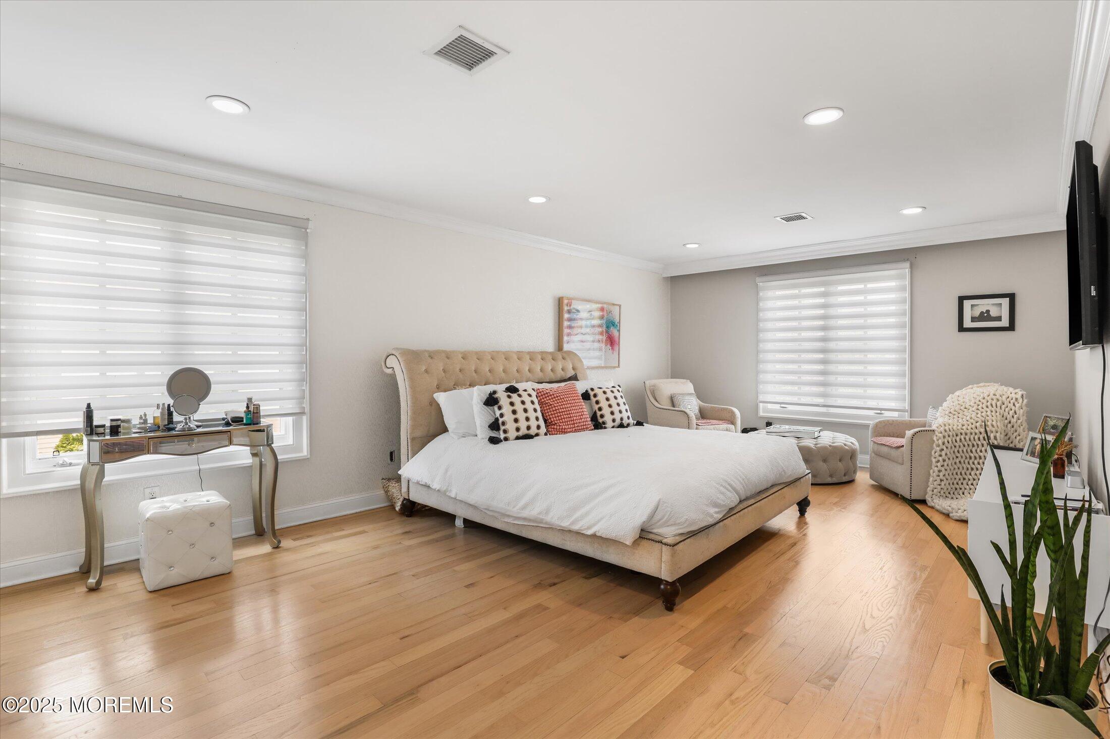 13 Valley Forge Road Eatontown, NJ 07724 - Photo 39 of 74 a spacious bedroom with a bed and a couch