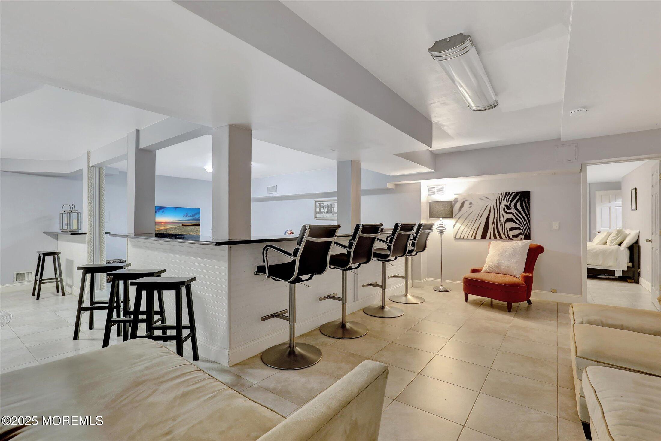 13 Valley Forge Road Eatontown, NJ 07724 - Photo 52 of 74 a living room with furniture and white walls