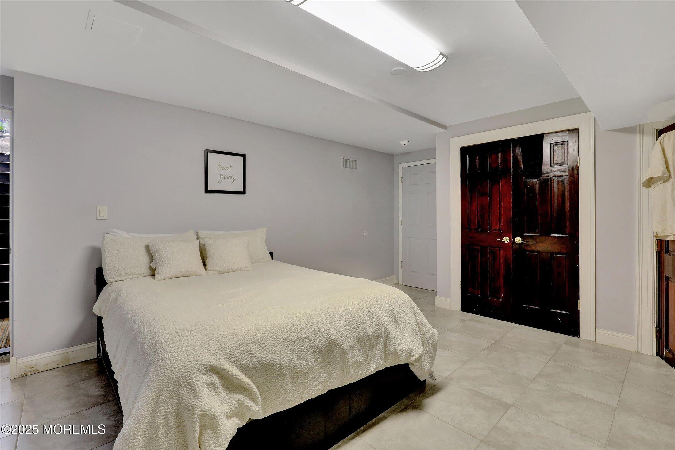 13 Valley Forge Road Eatontown, NJ 07724 - Photo 54 of 74 a bedroom with a bed and a bathroom