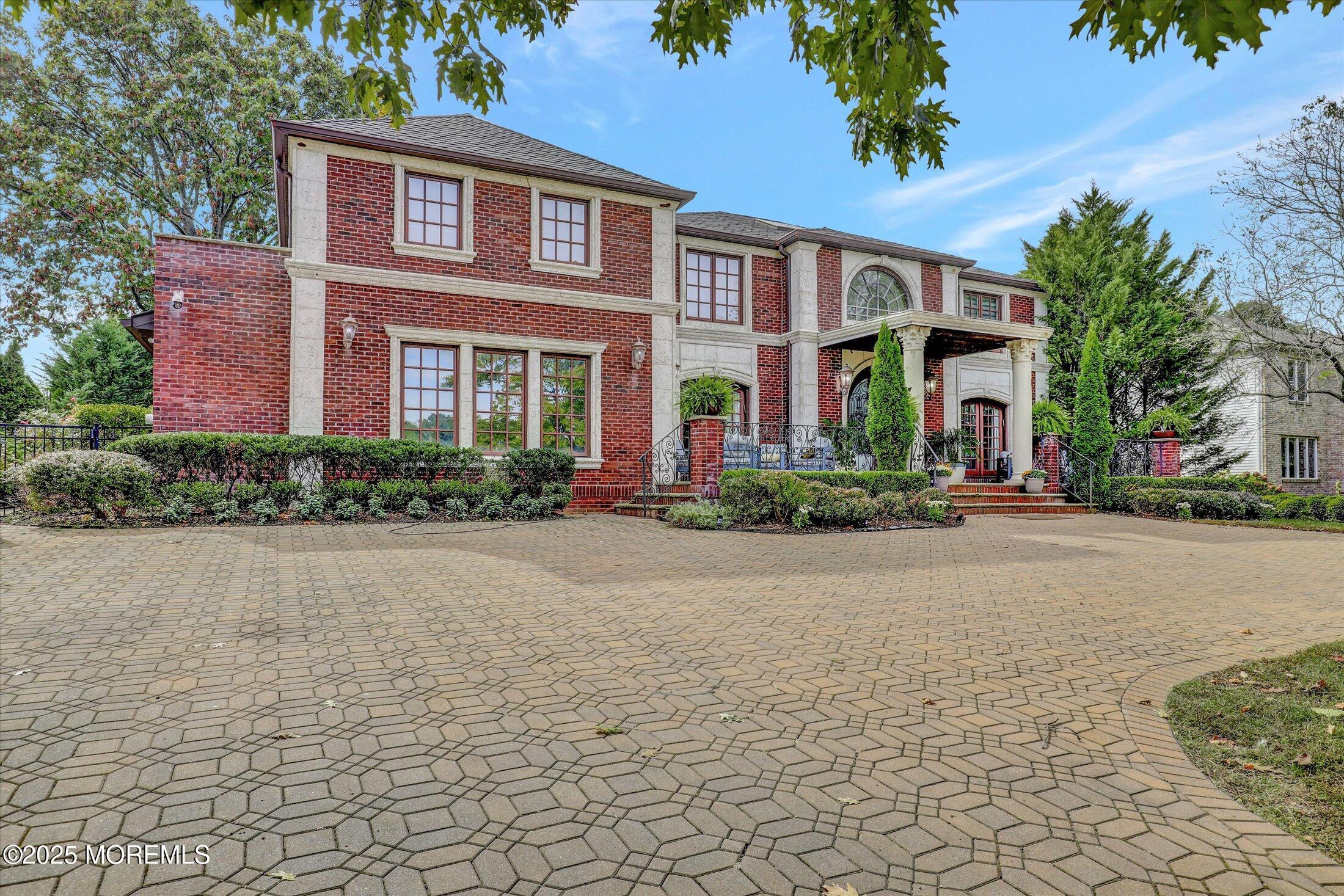 13 Valley Forge Road Eatontown, NJ 07724 - Photo 8 of 74 front view of a brick house with a yard