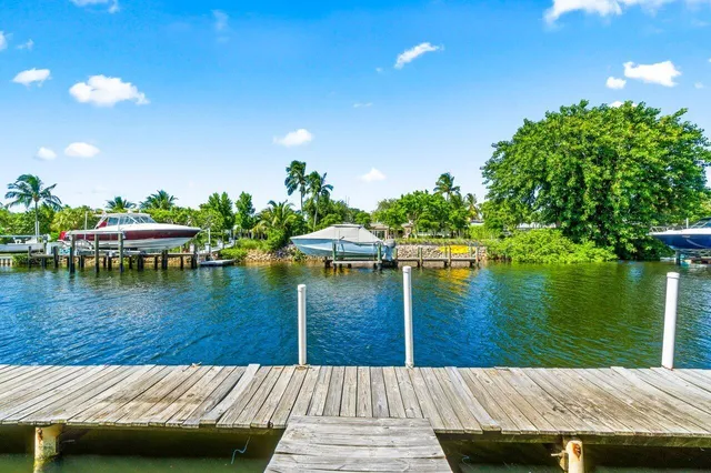 a view of balcony with furniture and garden