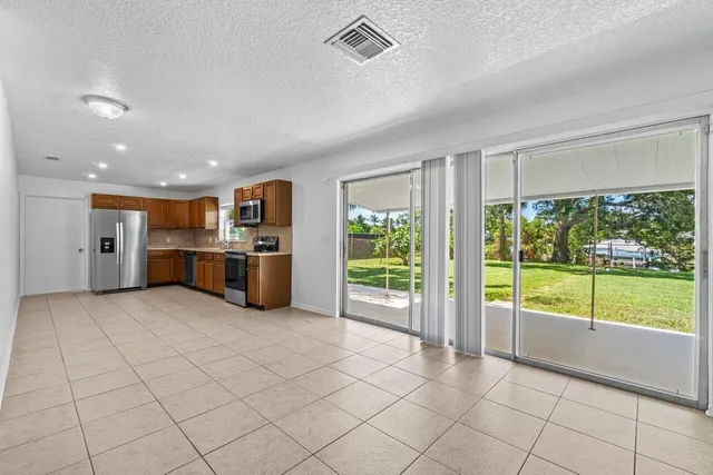 a view of kitchen with furniture and large window