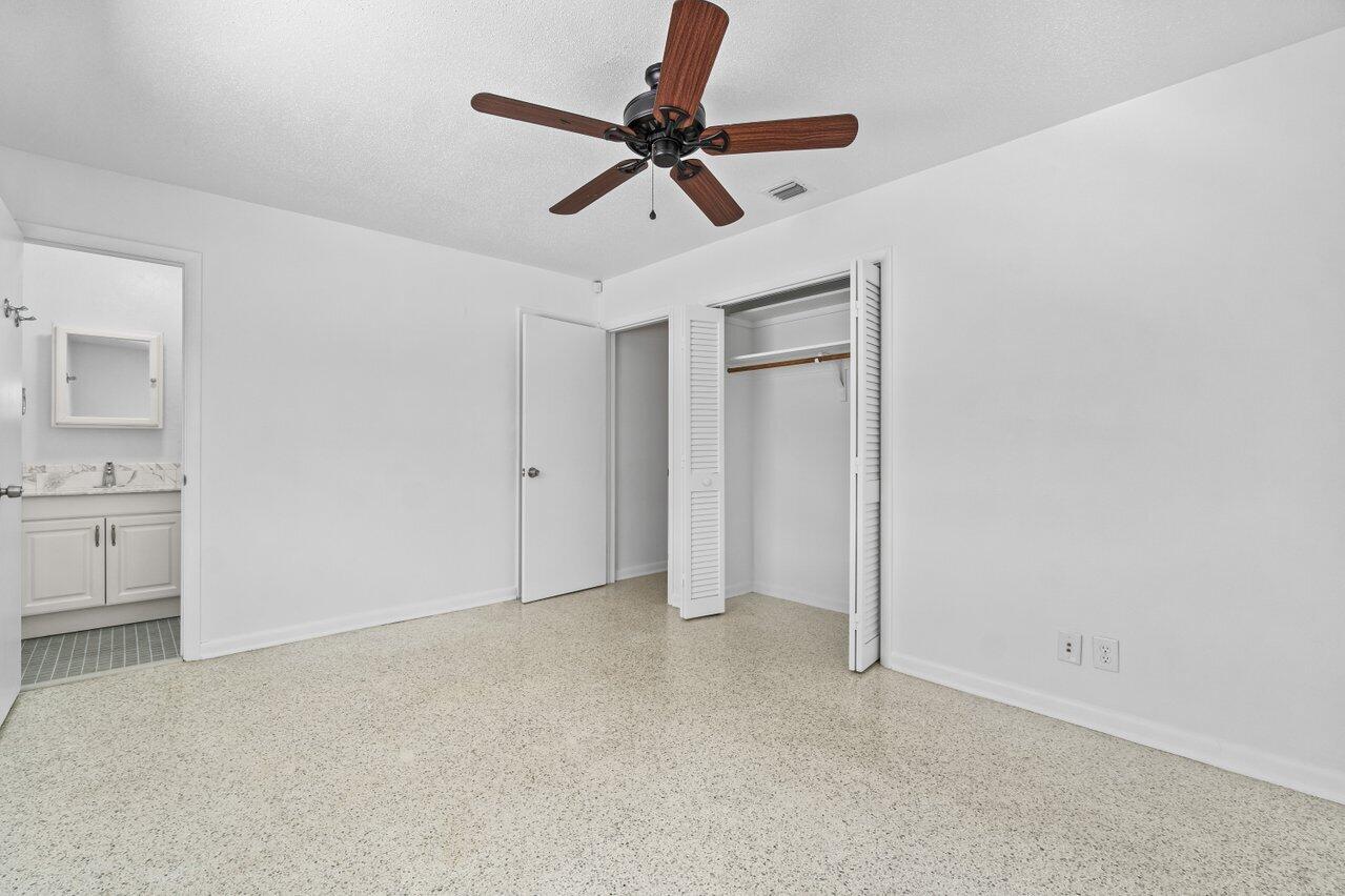 751 Hummingbird Way, Unit 7 North Palm Beach, FL 33408 - Photo 10 of 39 a view of room with a ceiling fan