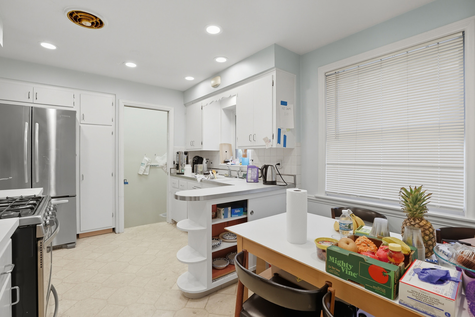 8728 Trumbull Avenue Skokie, IL 60076 - Photo 11 of 18 a room with furniture and a table