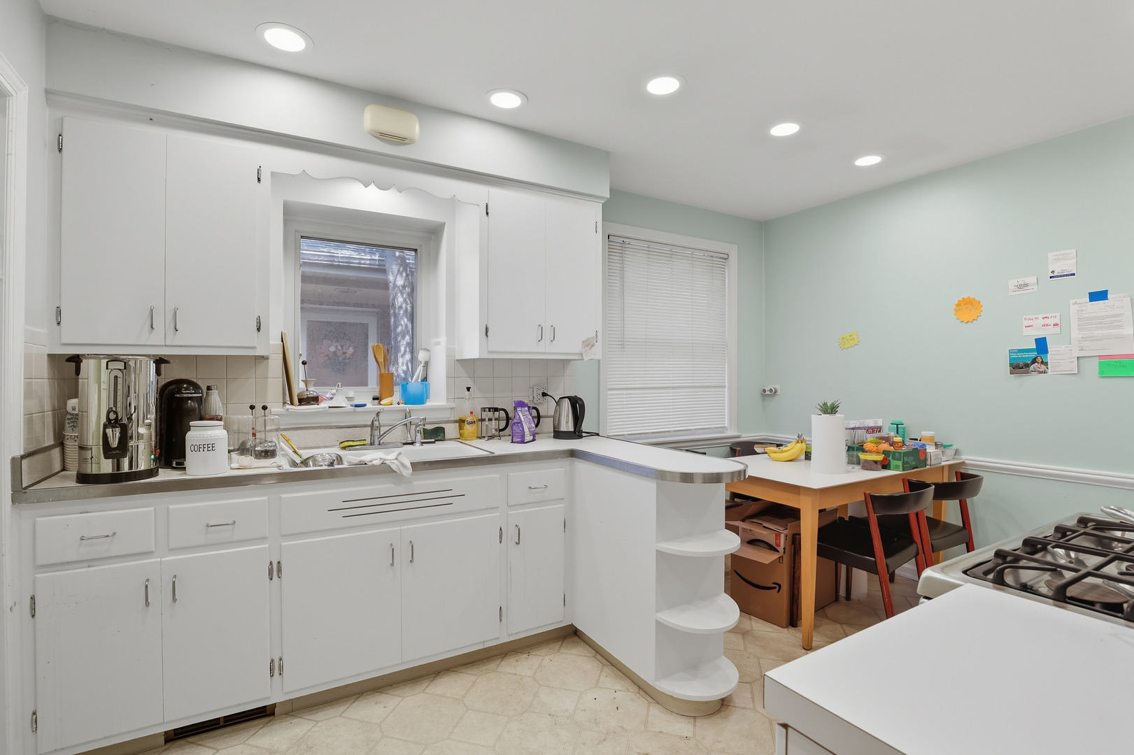 8728 Trumbull Avenue Skokie, IL 60076 - Photo 12 of 18 a kitchen that has a lot of cabinets in it and appliances