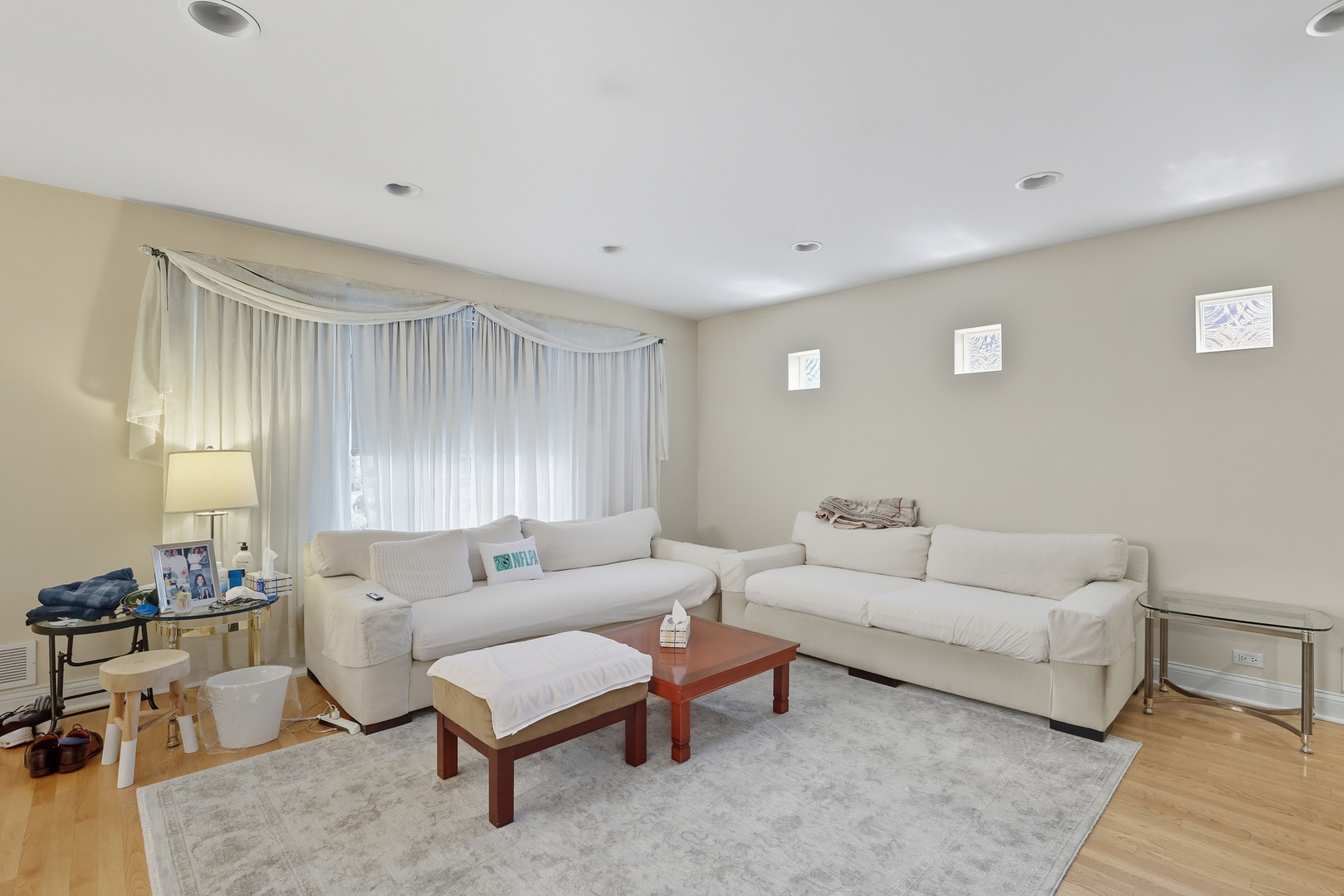 8728 Trumbull Avenue Skokie, IL 60076 - Photo 2 of 18 a living room with furniture and a couch