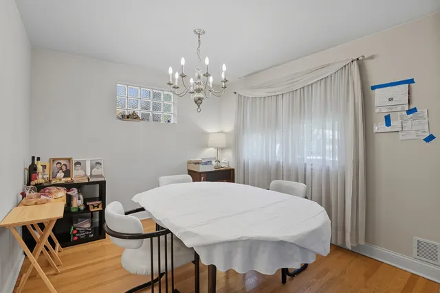 a spacious bedroom with a bed and a table in it