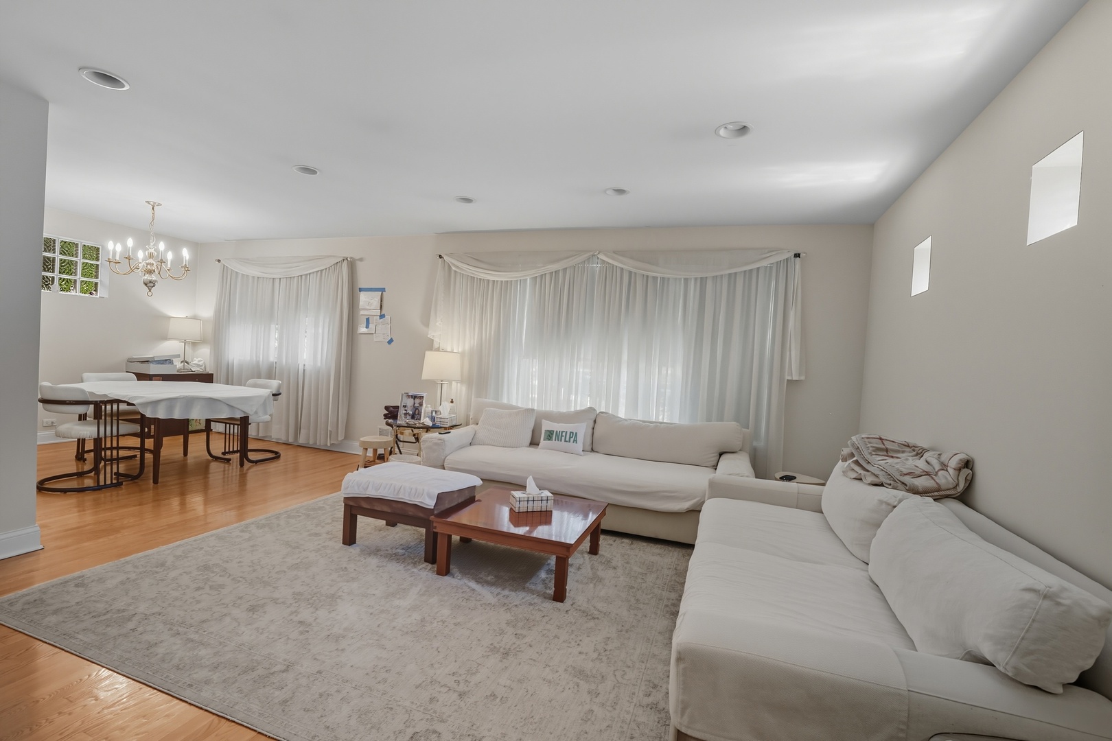 8728 Trumbull Avenue Skokie, IL 60076 - Photo 5 of 18 a living room with furniture and a table