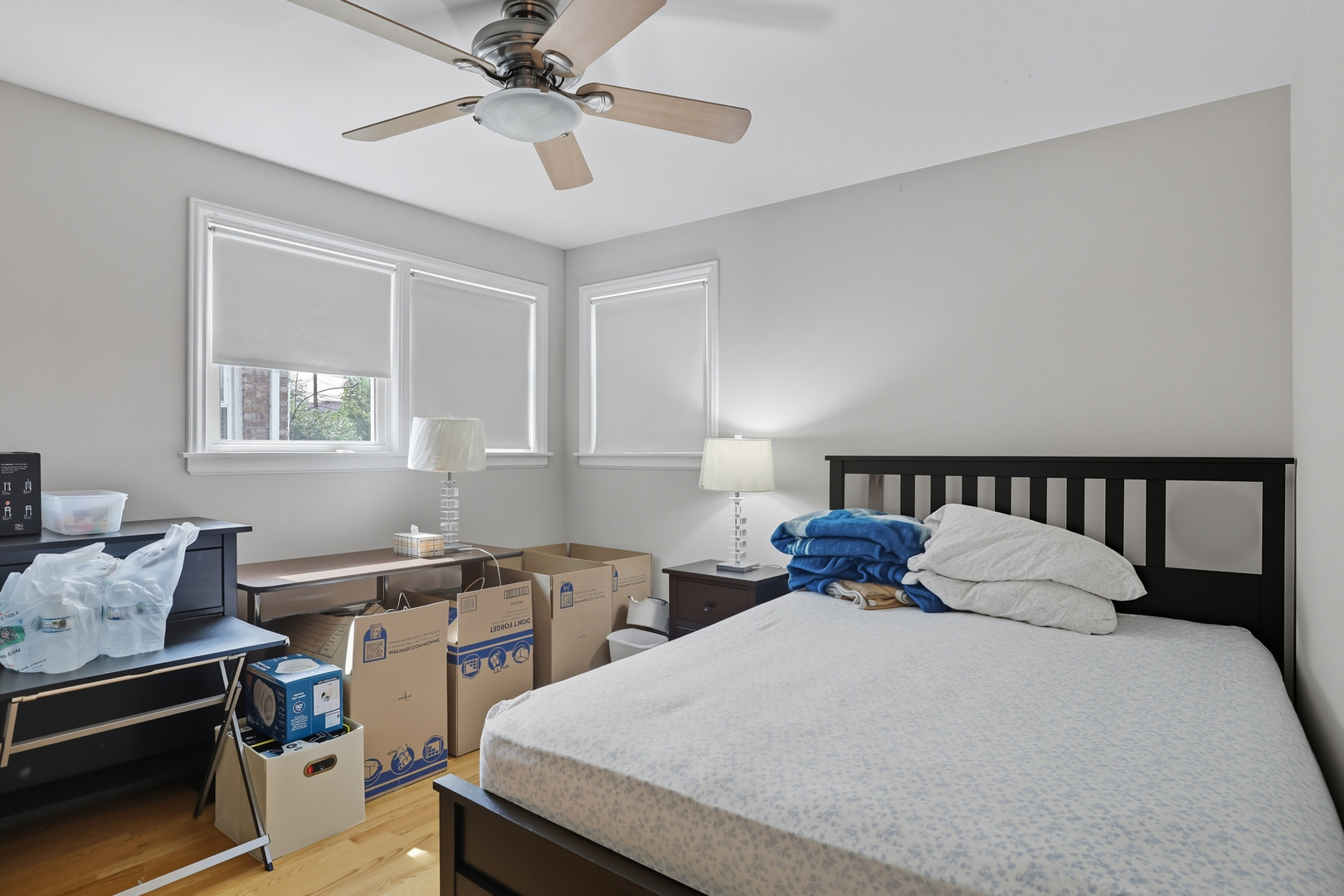 8728 Trumbull Avenue Skokie, IL 60076 - Photo 10 of 18 a bedroom with a bed and a chandelier