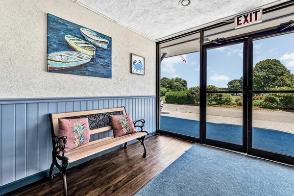 a reading room with furniture and a window