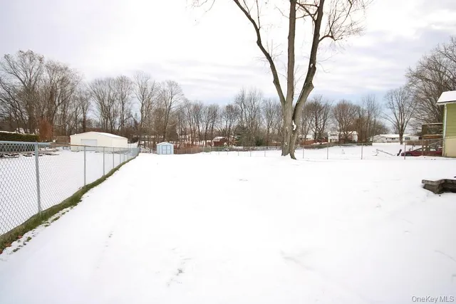 a view of a snow on the road