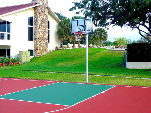 a view of a yard with a swimming pool