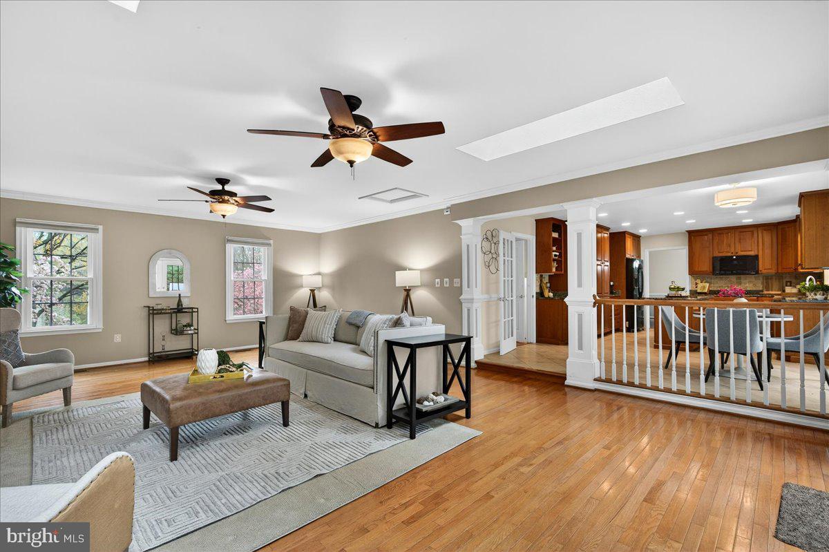 7723 Silver Sage Court Springfield, VA 22153 - Photo 14 of 63 a living room with furniture and a wooden floor