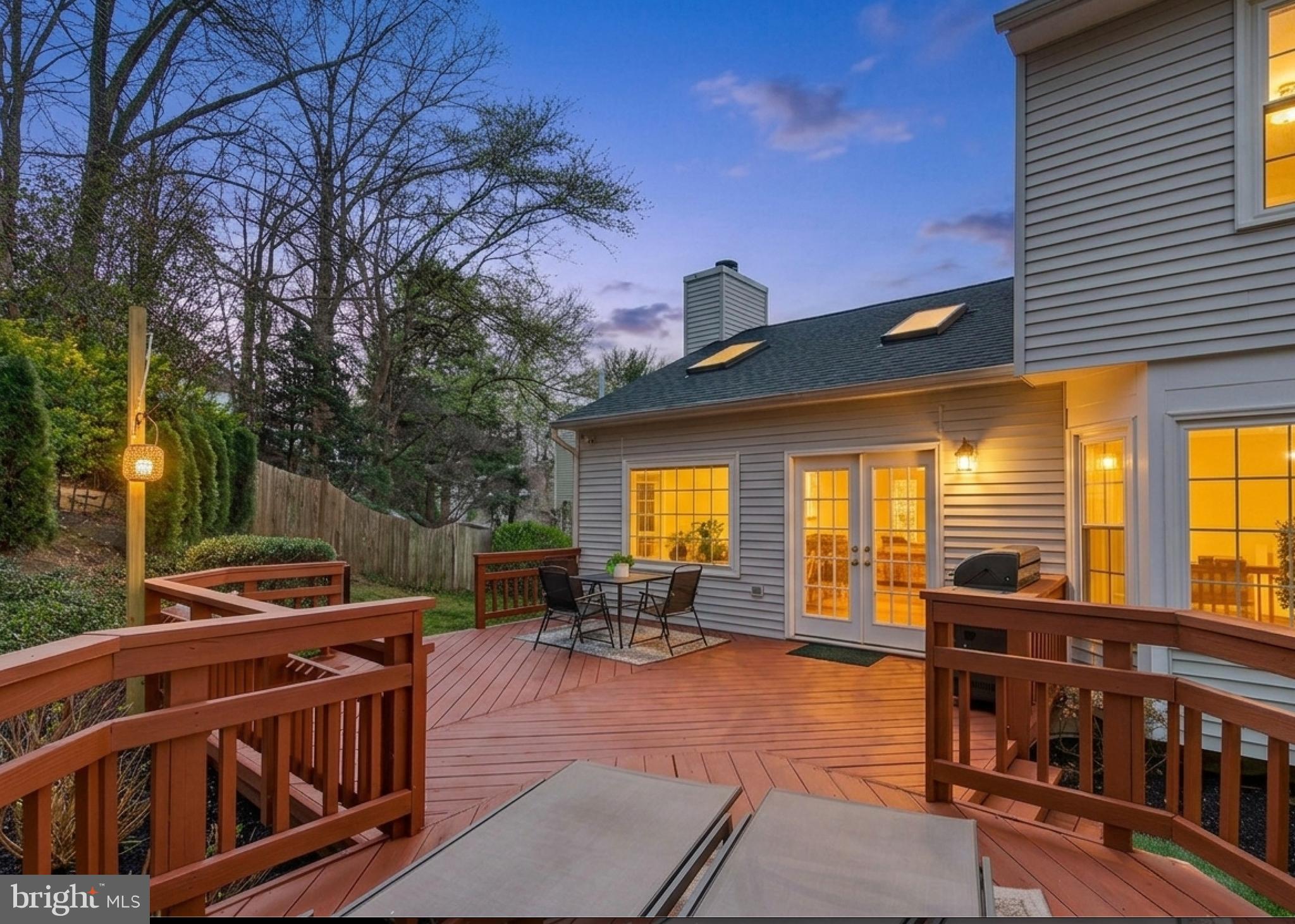 7723 Silver Sage Court Springfield, VA 22153 - Photo 21 of 63 a view of a patio with table and chairs barbeque potted plants and large tree