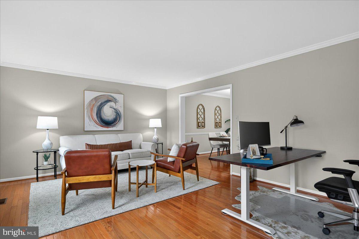 7723 Silver Sage Court Springfield, VA 22153 - Photo 24 of 63 a living room with furniture and a flat screen tv