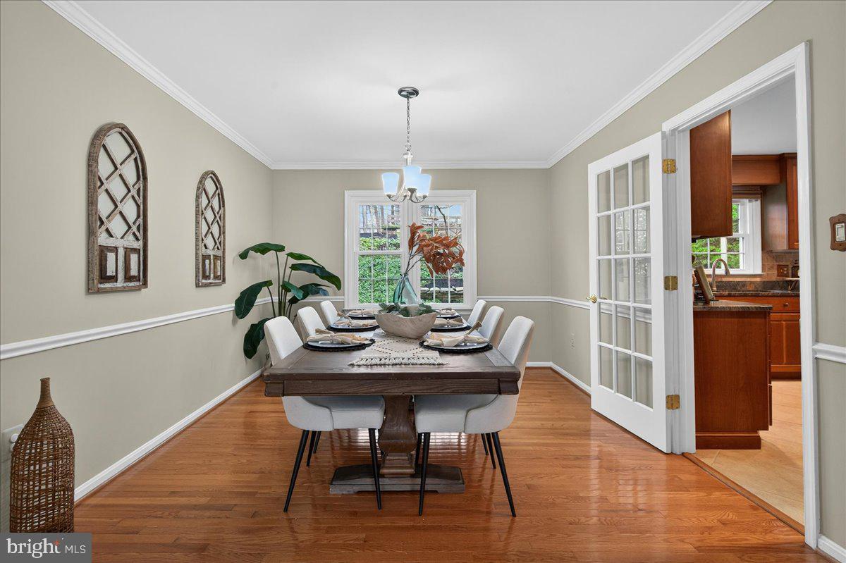 7723 Silver Sage Court Springfield, VA 22153 - Photo 27 of 63 a view of a dining room with furniture window and wooden floor