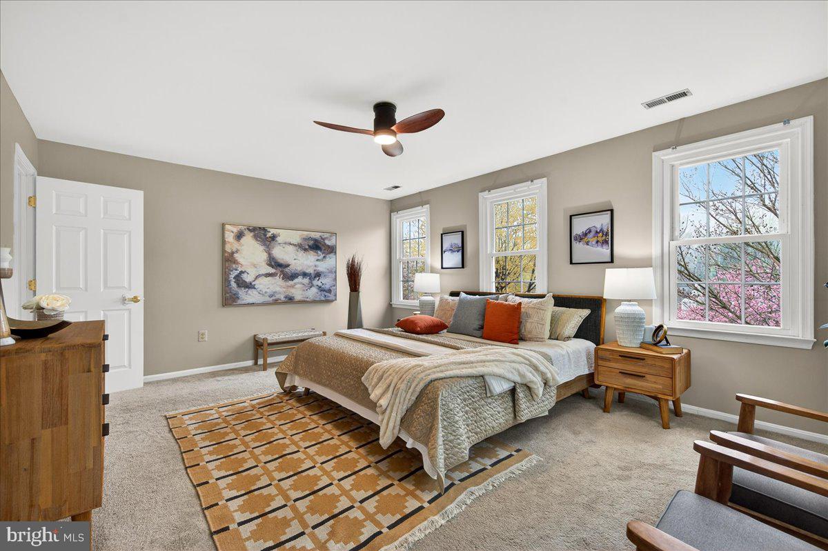 7723 Silver Sage Court Springfield, VA 22153 - Photo 31 of 63 a bedroom with a bed and wooden floor